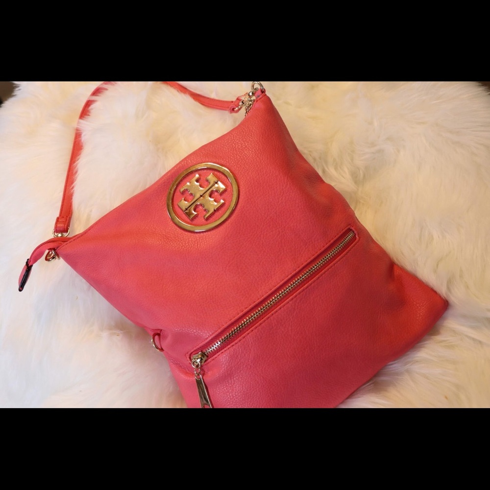 Tory Burch pink crossbody/clutch bag.